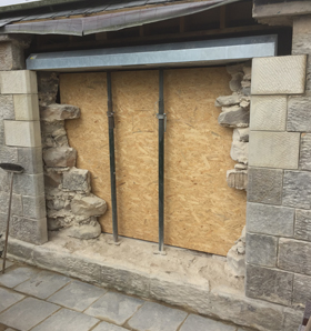 restorative work on stone wall showing inside progress of build